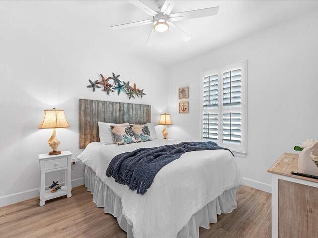 bedroom featuring wood-type flooring and ceiling fan