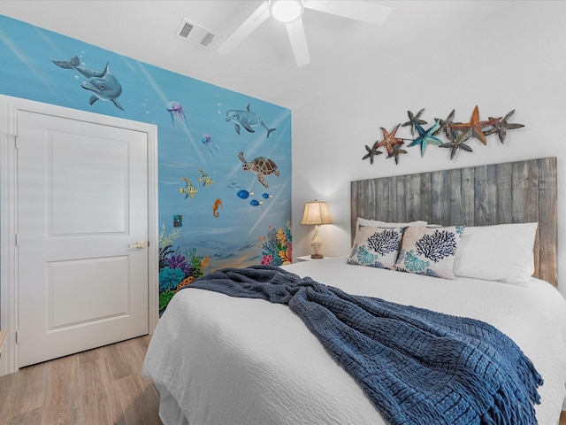 bedroom featuring light hardwood / wood-style floors and ceiling fan