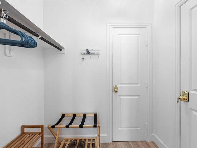 walk in closet featuring light hardwood / wood-style floors