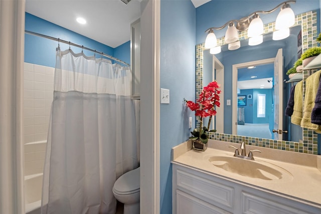 full bathroom with vanity, toilet, and shower / bath combo