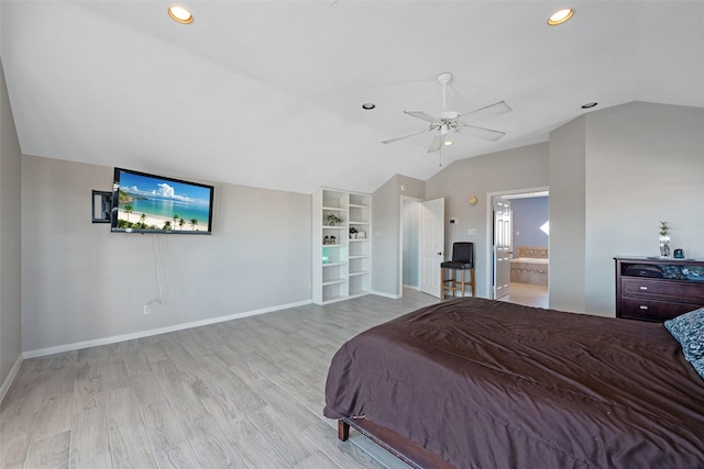 bedroom featuring ceiling fan, lofted ceiling, ensuite bath, and light wood-type flooring