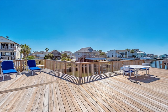 wooden deck with a water view