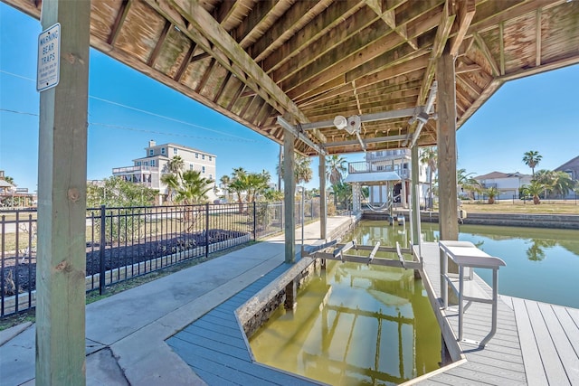 dock area with a water view