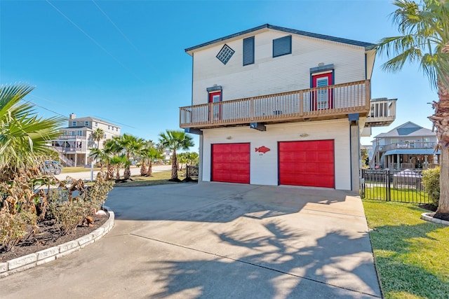 front of property with a balcony and a garage