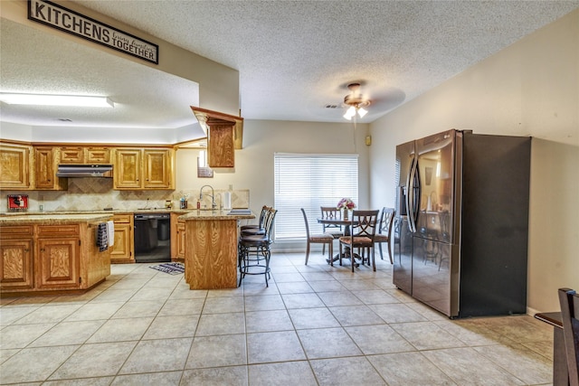 kitchen featuring dishwasher, kitchen peninsula, light tile patterned floors, and stainless steel fridge with ice dispenser