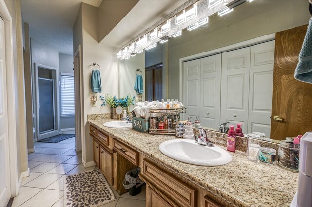 bathroom with vanity and tile patterned floors