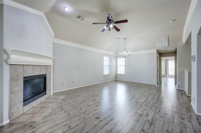 unfurnished living room with ornamental molding, a fireplace, and light hardwood / wood-style floors