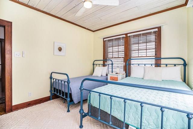 bedroom with crown molding, carpet floors, wooden ceiling, and ceiling fan