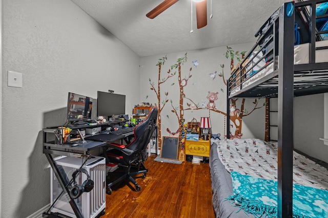 office area with ceiling fan, hardwood / wood-style floors, and a textured ceiling