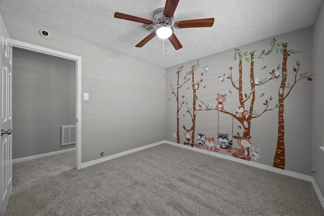 2817 John St, La Marque, TX 77568 - unfurnished room featuring visible vents, carpet flooring, a textured ceiling, and ceiling fan