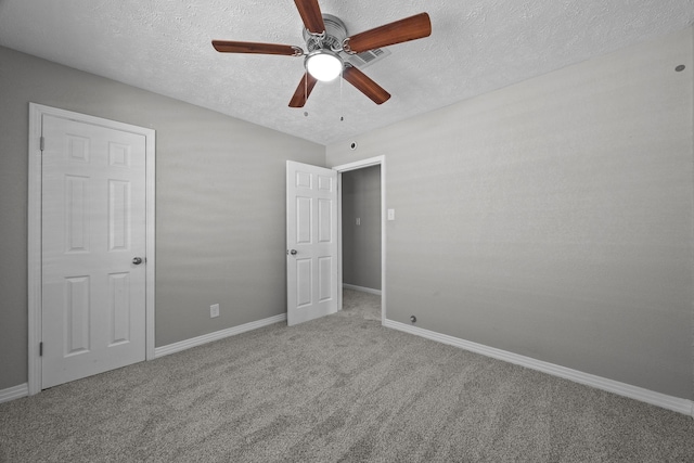 2817 John St, La Marque, TX 77568 - unfurnished bedroom featuring ceiling fan, a textured ceiling, visible vents, carpet floors, and baseboards