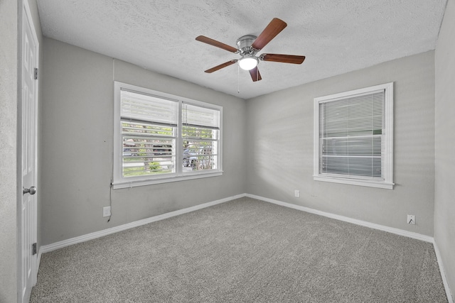 2817 John St, La Marque, TX 77568 - unfurnished room with carpet floors and a textured ceiling