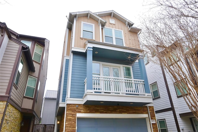 view of front of home with a balcony and a garage