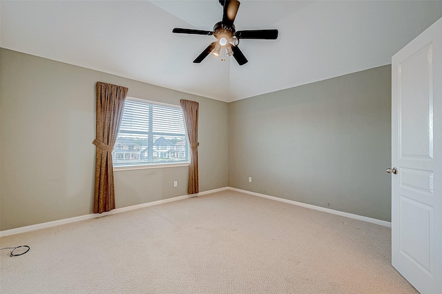 unfurnished room featuring ceiling fan, vaulted ceiling, and light carpet