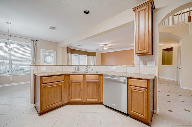 kitchen featuring sink, light tile patterned floors, decorative backsplash, stainless steel dishwasher, and kitchen peninsula