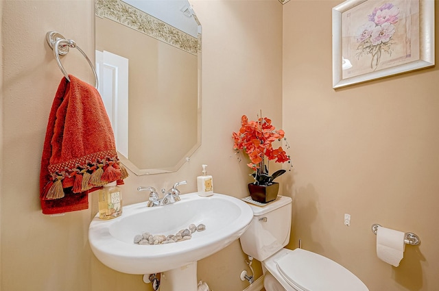 bathroom with sink and toilet