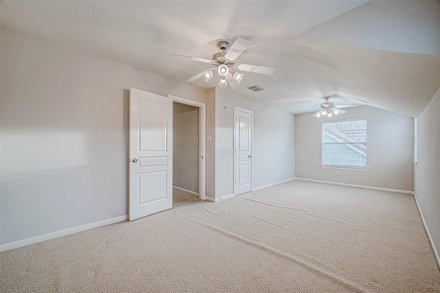 bonus room with vaulted ceiling, ceiling fan, and carpet