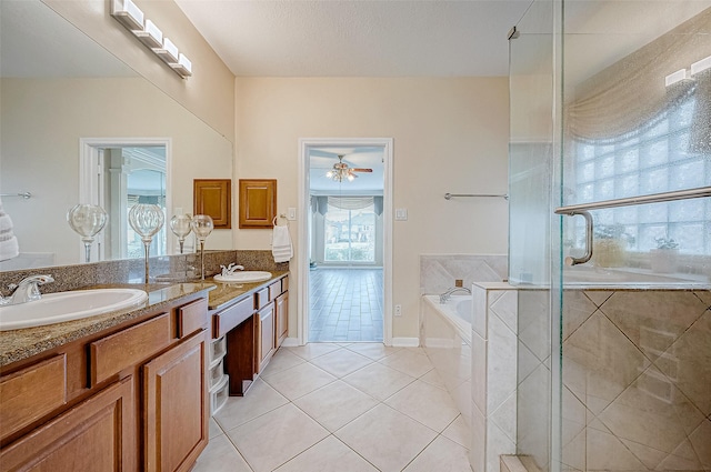 bathroom with vanity, tile patterned floors, and independent shower and bath