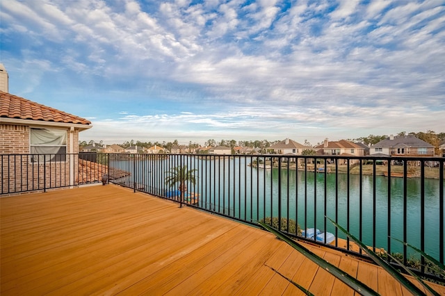 wooden terrace with a water view