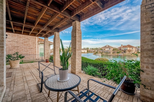 view of patio / terrace with a water view