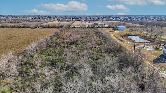 bird's eye view featuring a water view and a rural view