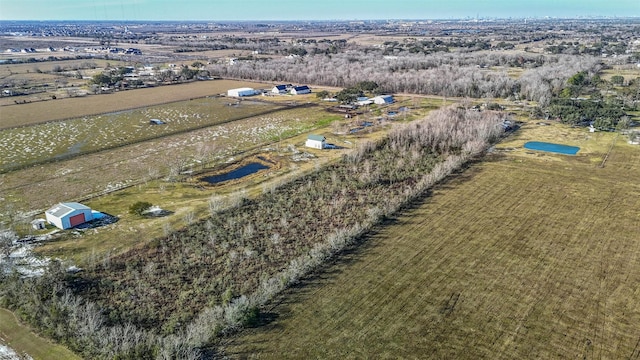 birds eye view of property featuring a rural view