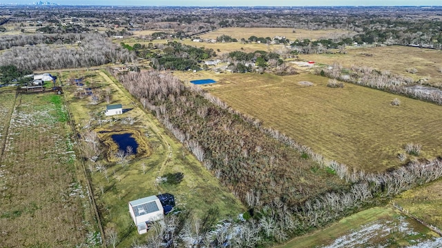 birds eye view of property with a rural view