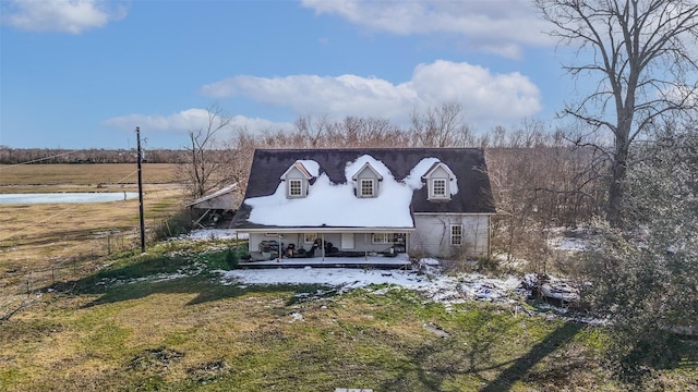 back of house with a yard and covered porch