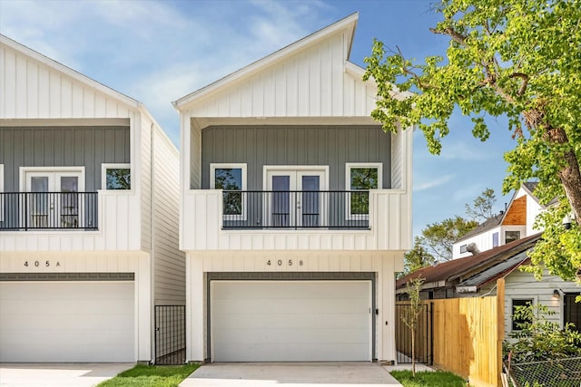 view of front of home with a garage and a balcony