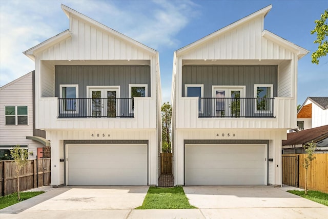 view of front of property featuring a garage and a balcony