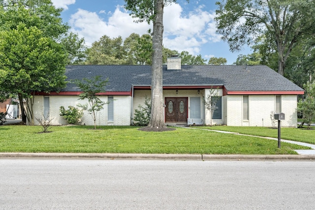 view of front of home with a front yard