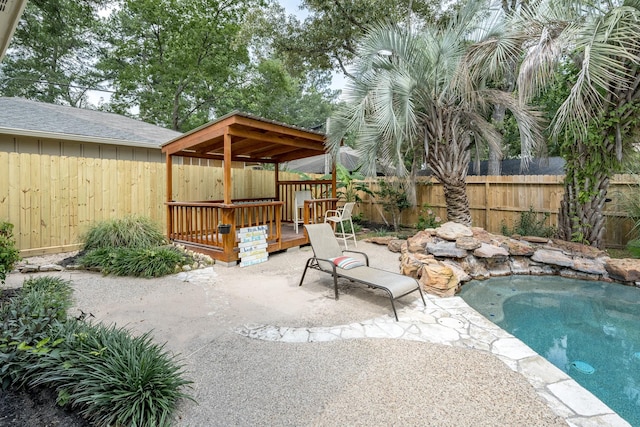 view of pool with a deck and a patio