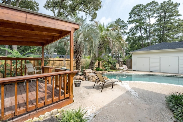 view of swimming pool featuring a wooden deck