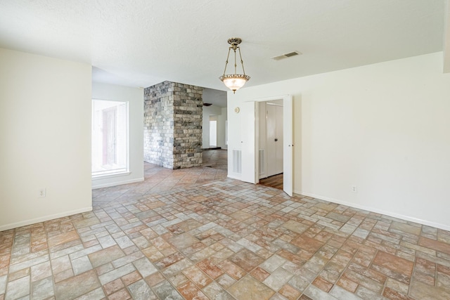 interior space with a textured ceiling