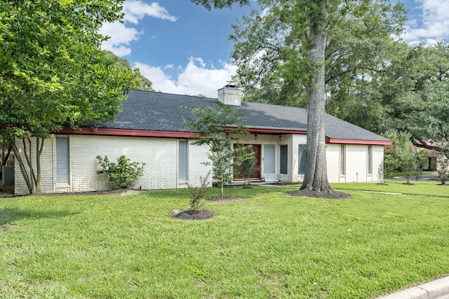 ranch-style house with a garage and a front lawn