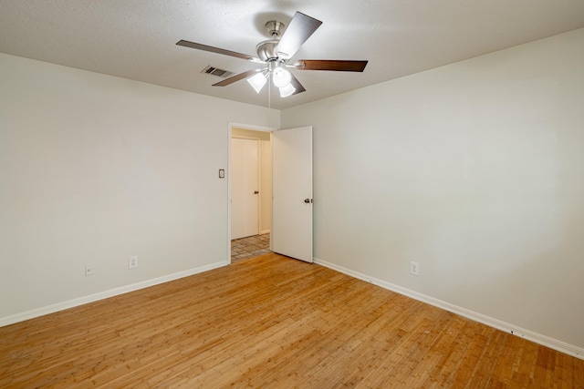 unfurnished room with light hardwood / wood-style flooring and ceiling fan