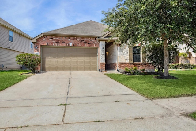 view of front of property featuring a garage and a front lawn