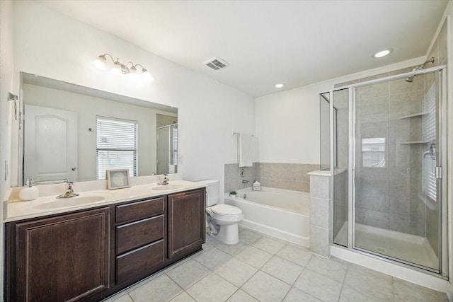 full bathroom with shower with separate bathtub, vanity, tile patterned floors, and toilet