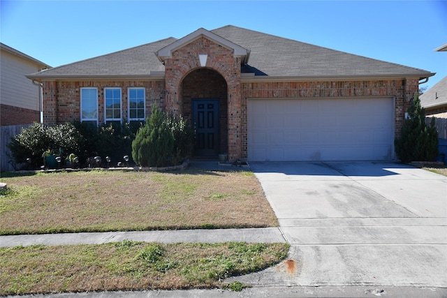 ranch-style house with a garage and a front yard