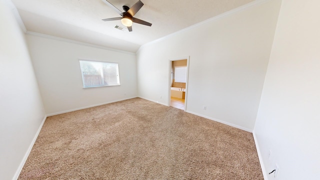 empty room featuring light carpet, crown molding, vaulted ceiling, and ceiling fan