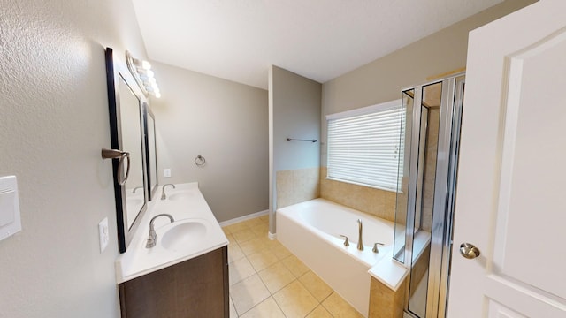 bathroom with tile patterned flooring, vanity, and plus walk in shower