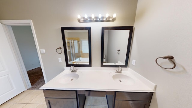 bathroom featuring tile patterned flooring, vanity, and shower with separate bathtub