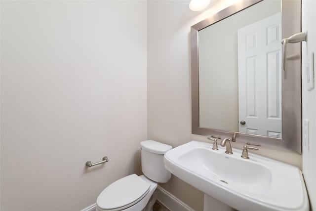 bathroom with sink and toilet