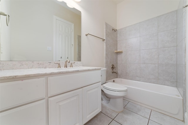 full bathroom with vanity, toilet, tiled shower / bath combo, and tile patterned flooring