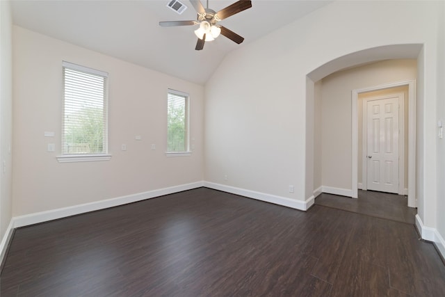 spare room featuring vaulted ceiling, ceiling fan, and dark hardwood / wood-style flooring