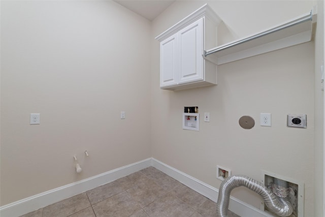 laundry room featuring light tile patterned flooring, cabinets, hookup for a washing machine, hookup for an electric dryer, and hookup for a gas dryer