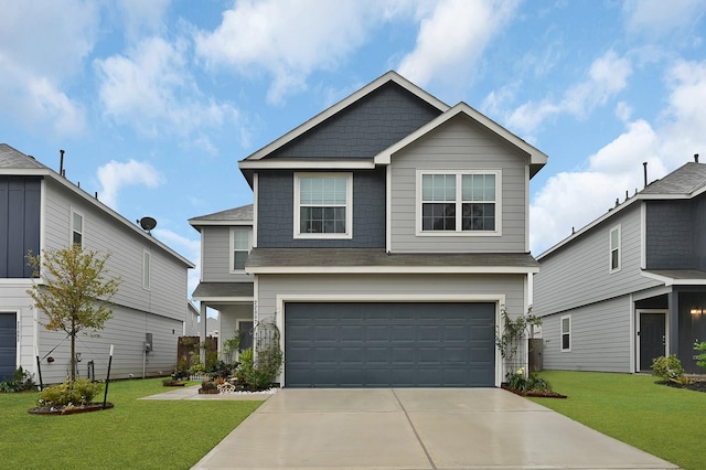 view of front of home featuring a garage and a front yard