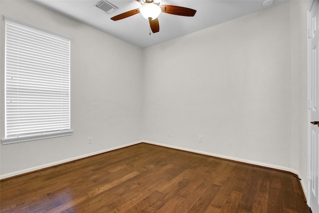 spare room featuring hardwood / wood-style floors and ceiling fan