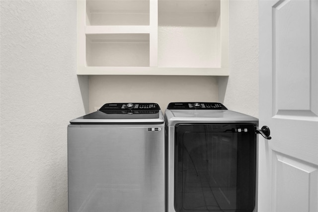 laundry room featuring washer and clothes dryer