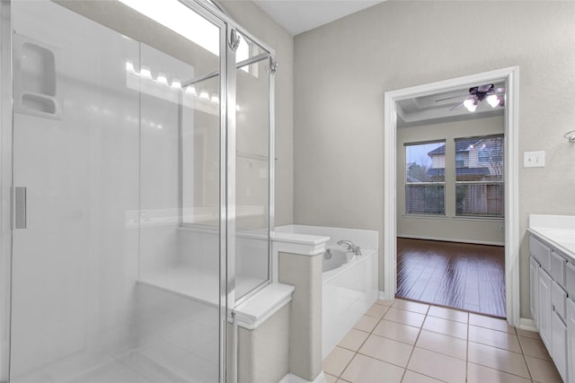 bathroom with ceiling fan, vanity, independent shower and bath, and tile patterned flooring